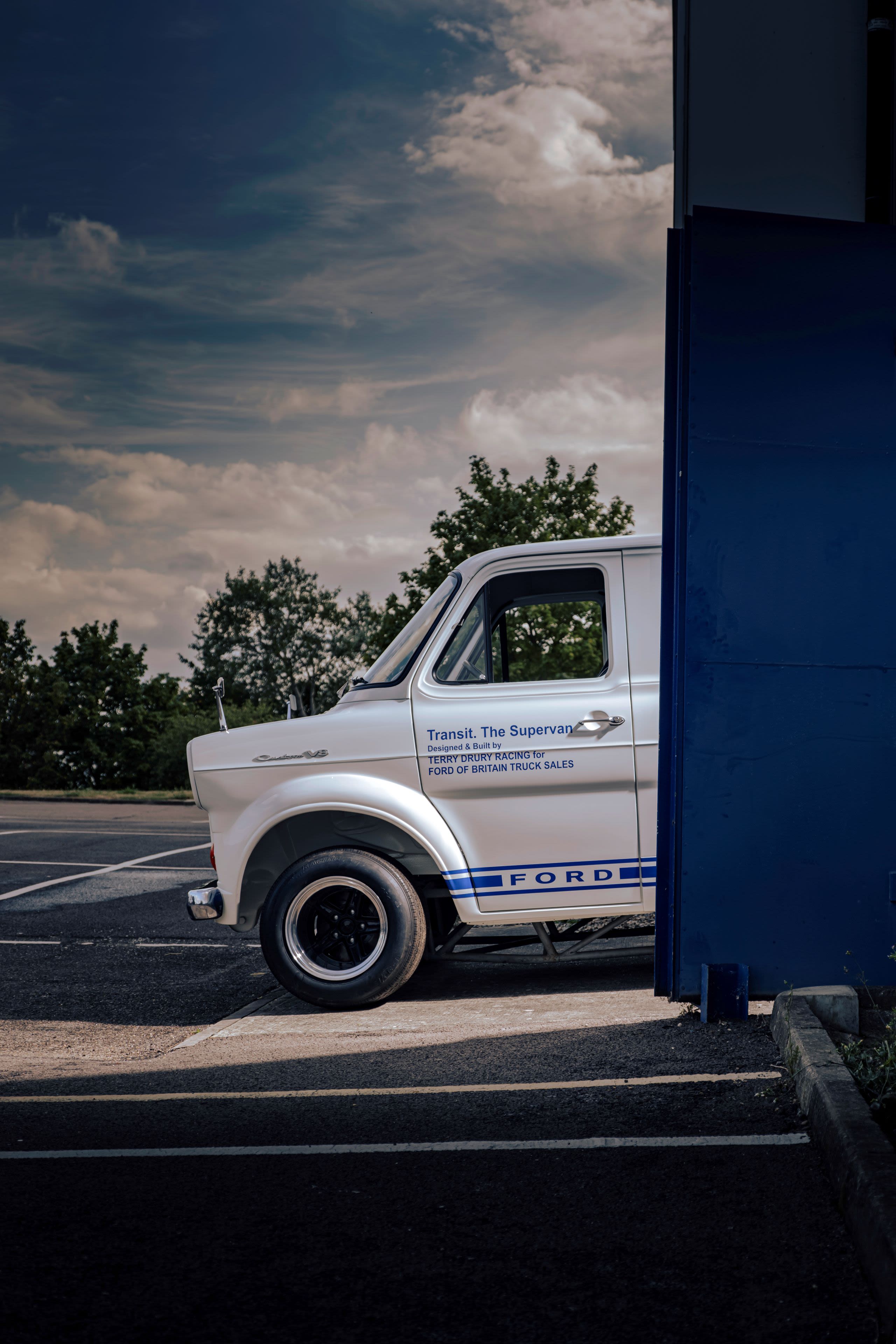 The front of Supervan 1 peeking out of the front of a garage