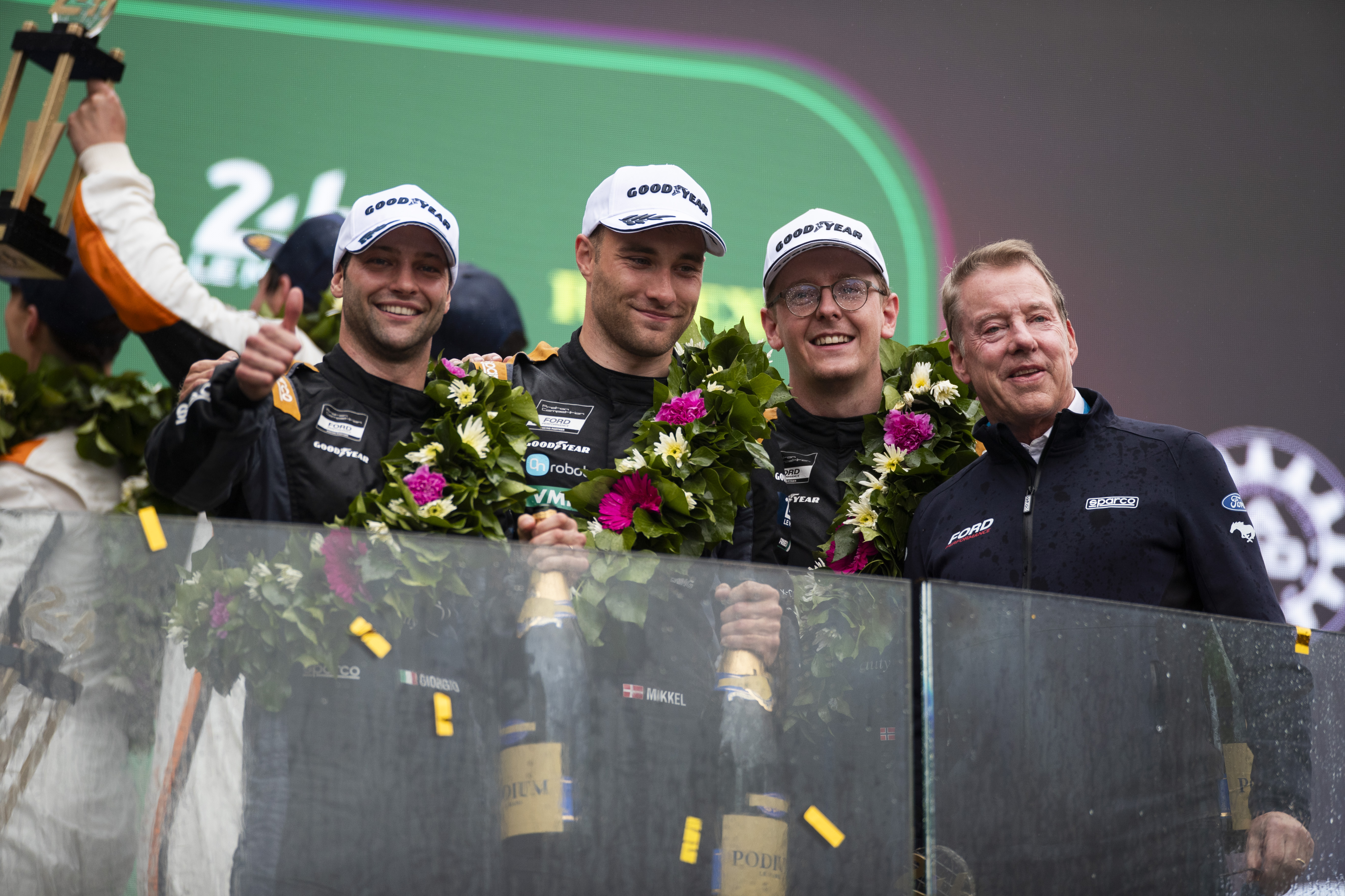 Giorgio Roda, Mikkel O. Pedersen, and Dennis Olsen, who teamed up to finish third in the LMGT3 category at the 24 Hours of Le Mans, along with Ford Chair Bill Ford. Photo by Drew Gibson.