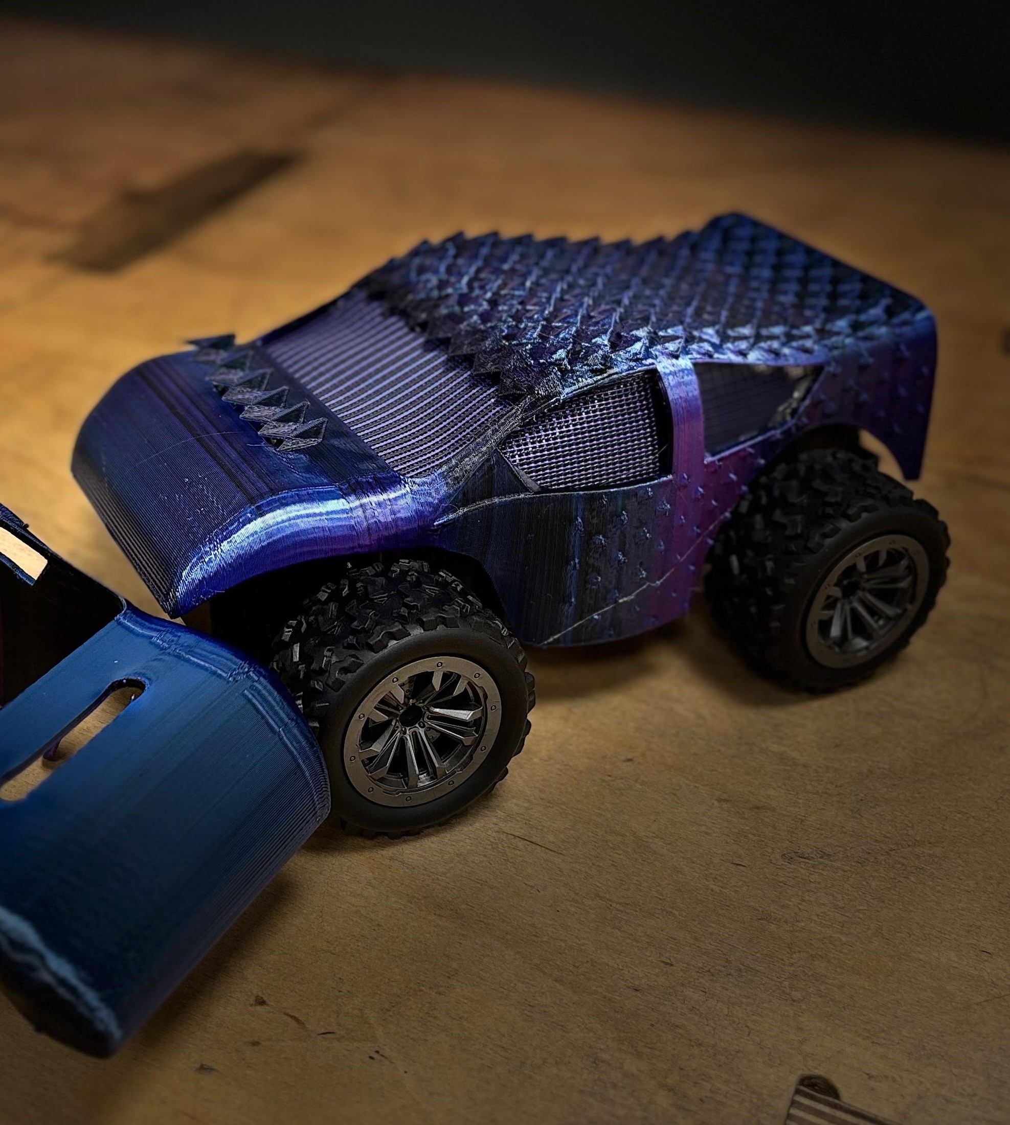 Solar panels shaped like fish scales, overlaid on a model car