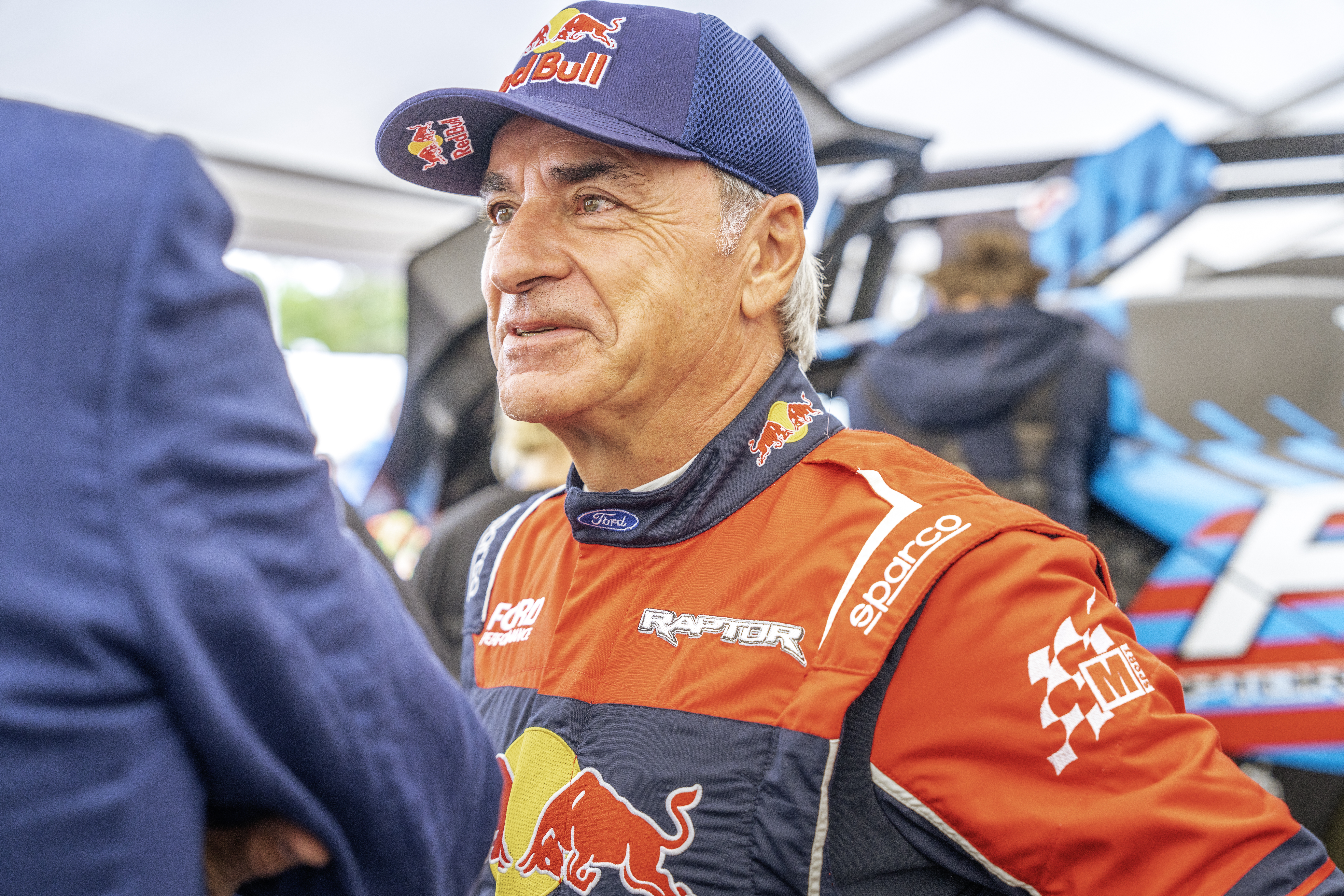 Rally legend Carlos Sainz at the 2024 Goodwood Festival of Speed. License valid for earned editorial, press releases, press kits. All non-broadcast digital and online media Region: Global. This content is solely for editorial use and for providing individual users with information. Any storage in databases, or any distribution to third parties within the scope of commercial use, or for commercial use is permitted with written consent from Ford in Europe GmbH only.