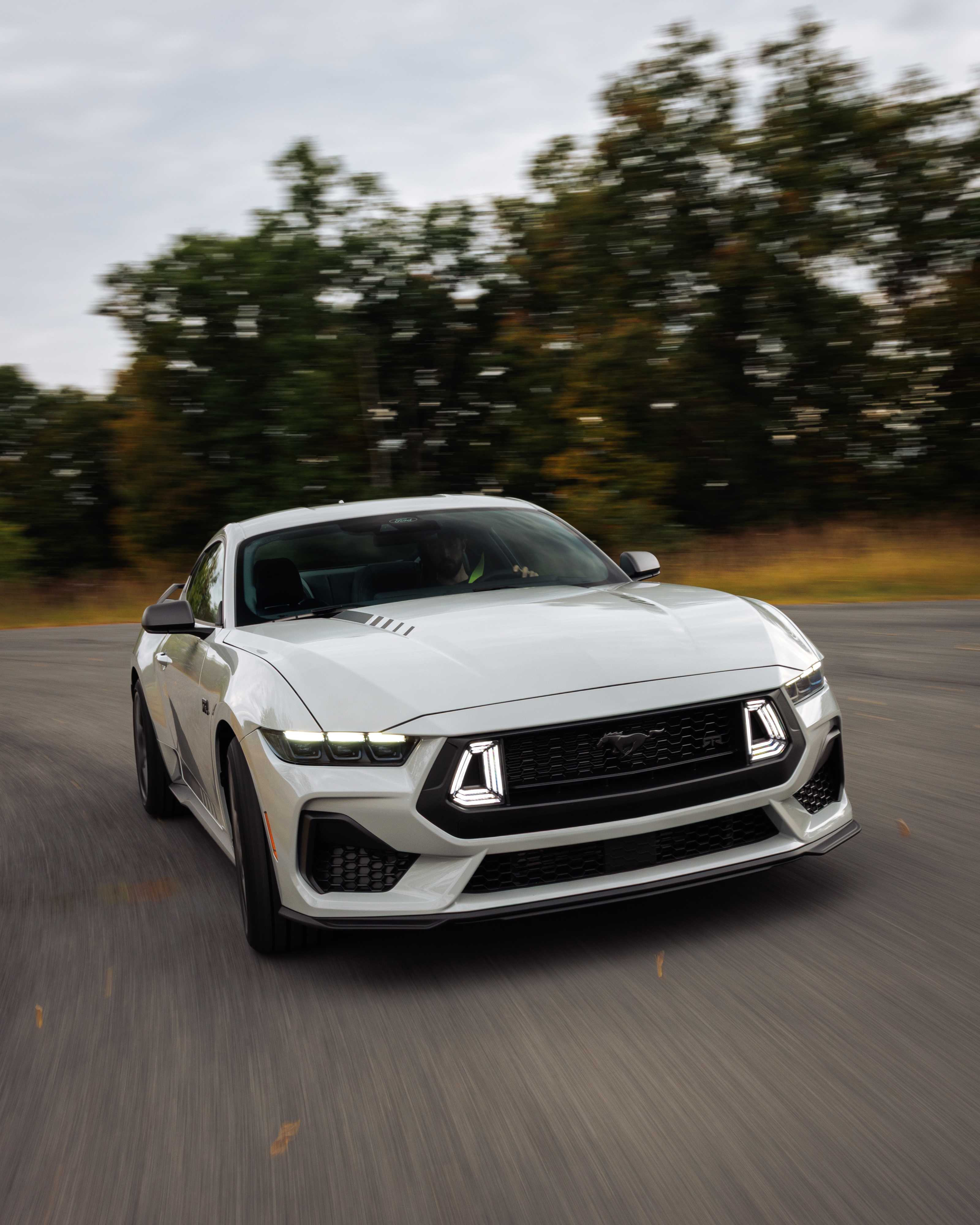 Optional RTR package available on 2026 Ford Mustang EcoBoost fastback. Preproduction model shown with optional Hyper Lime brake caliper shown. Available late spring 2026.