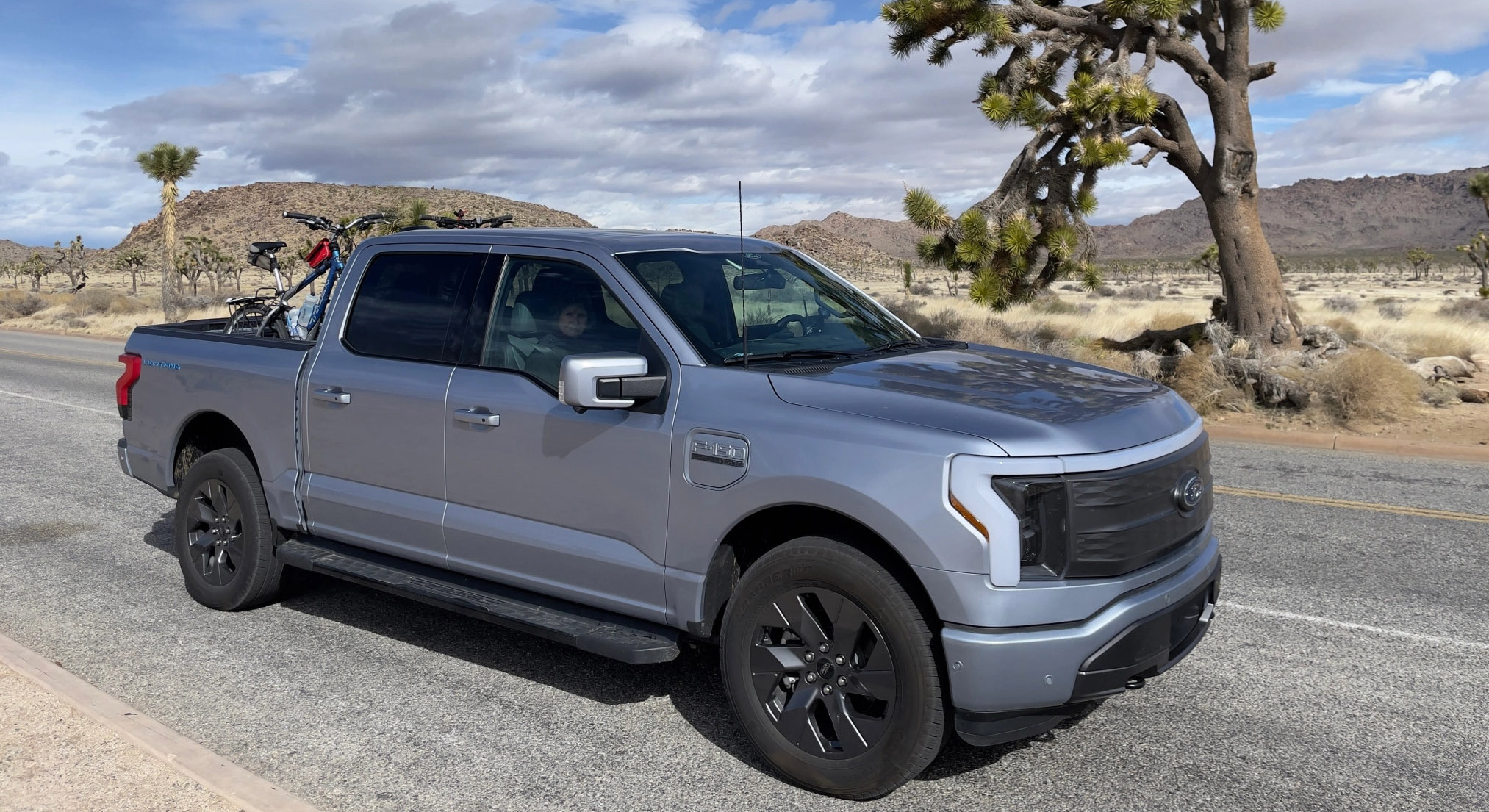 Sherman the F-150® Lightning® truck parked along a scenic route.