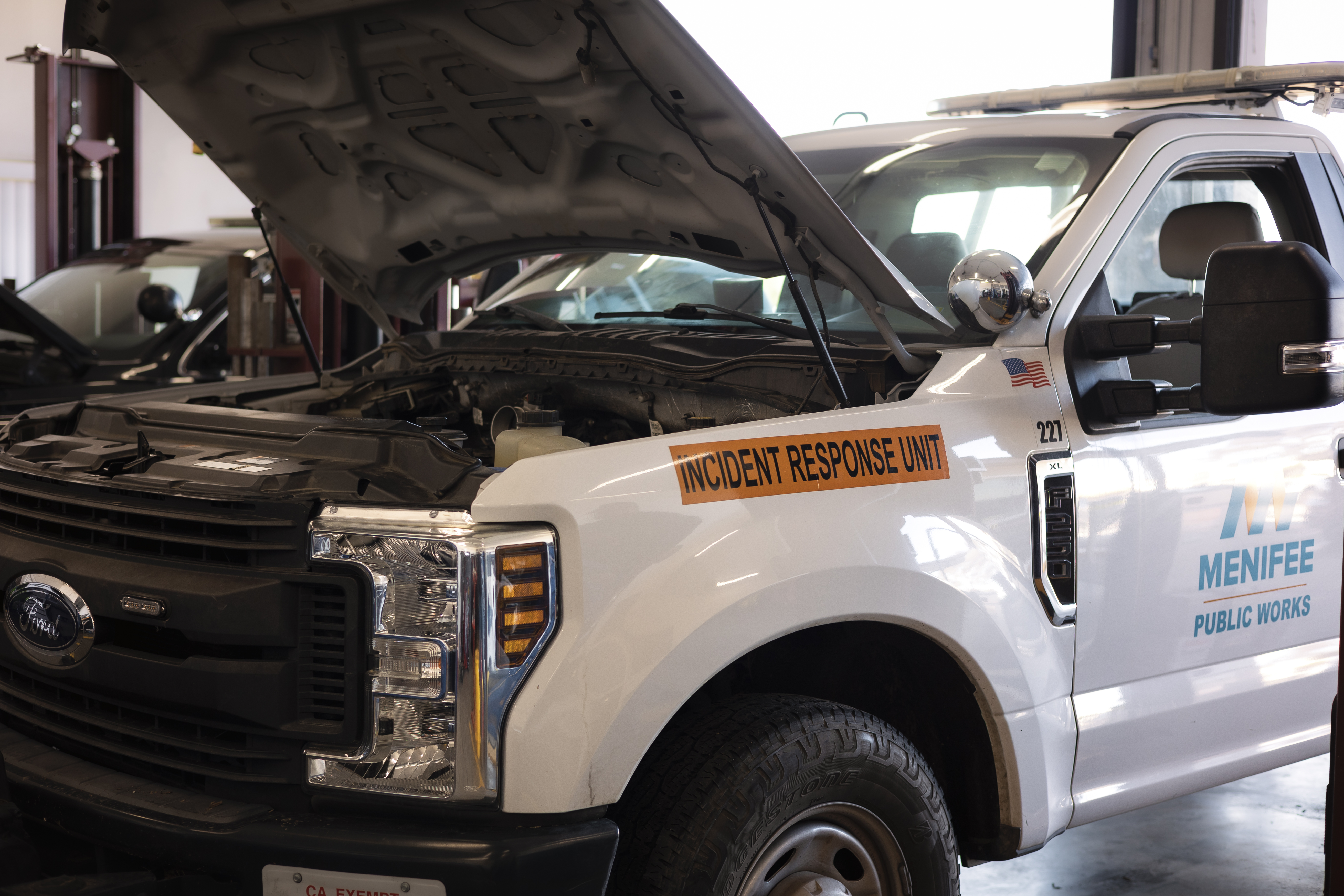 A City of Menifee Ford truck with the hood popped. 