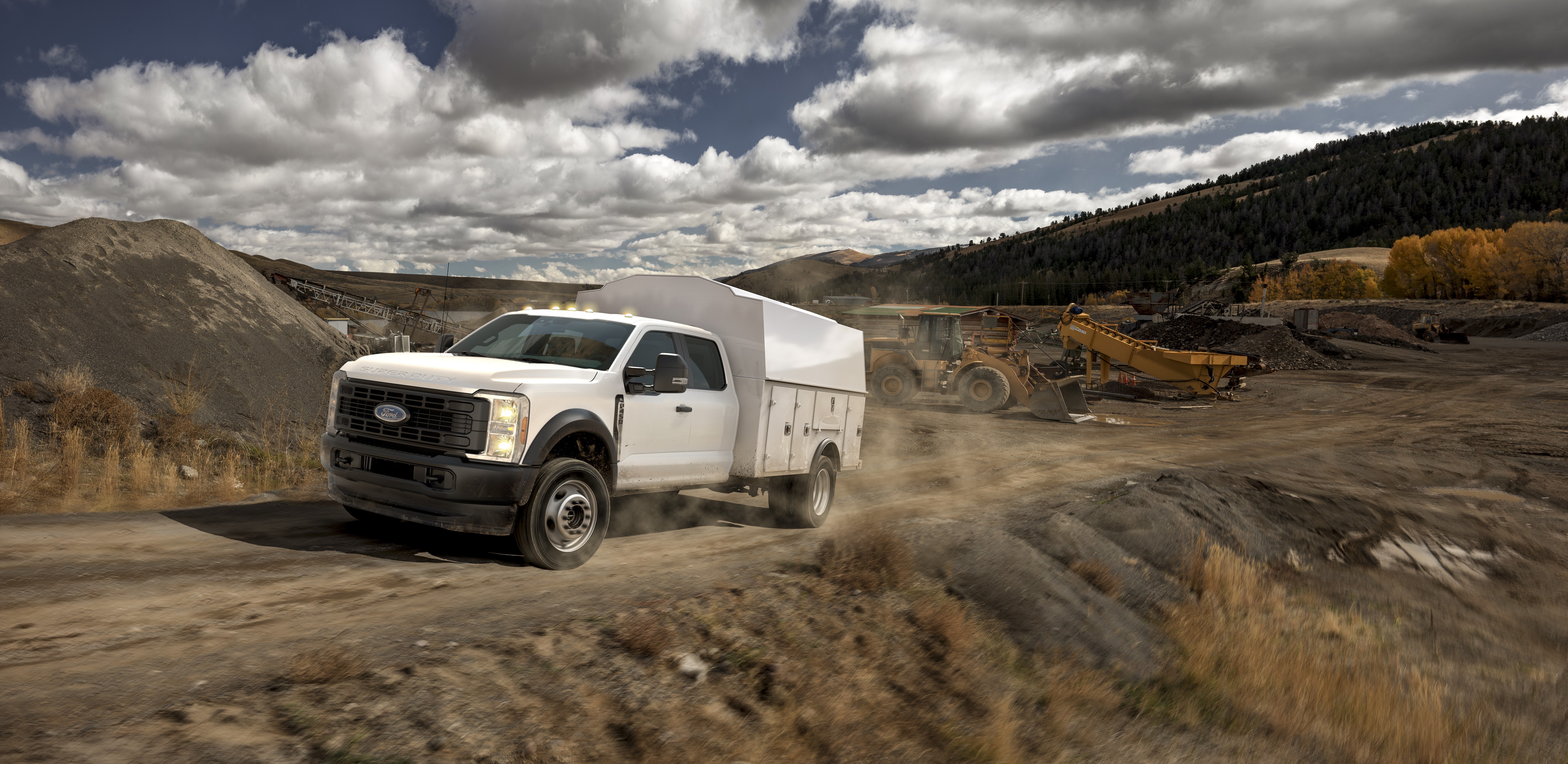 An upfitted 2025 F-450 Super Duty® Chassis Cab XL on a work site.