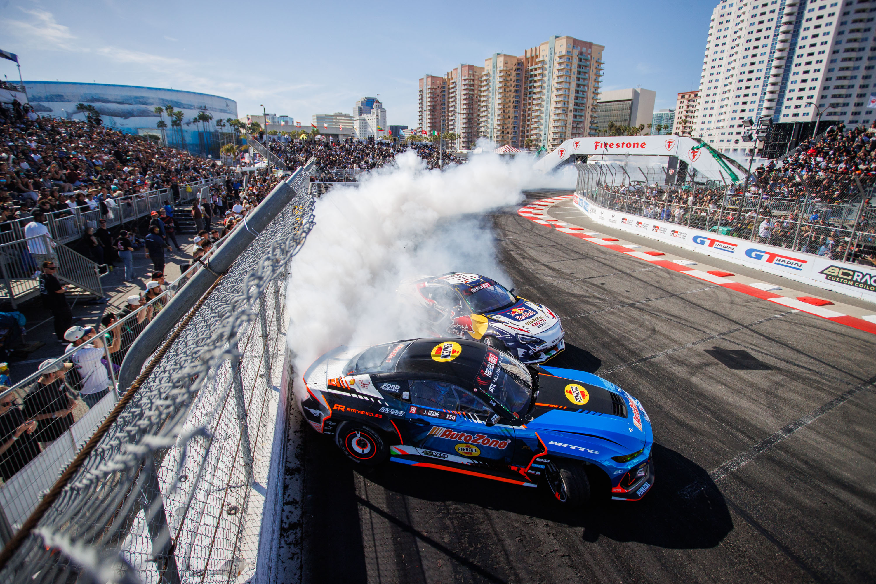 A Mustang drifts on a racetrack