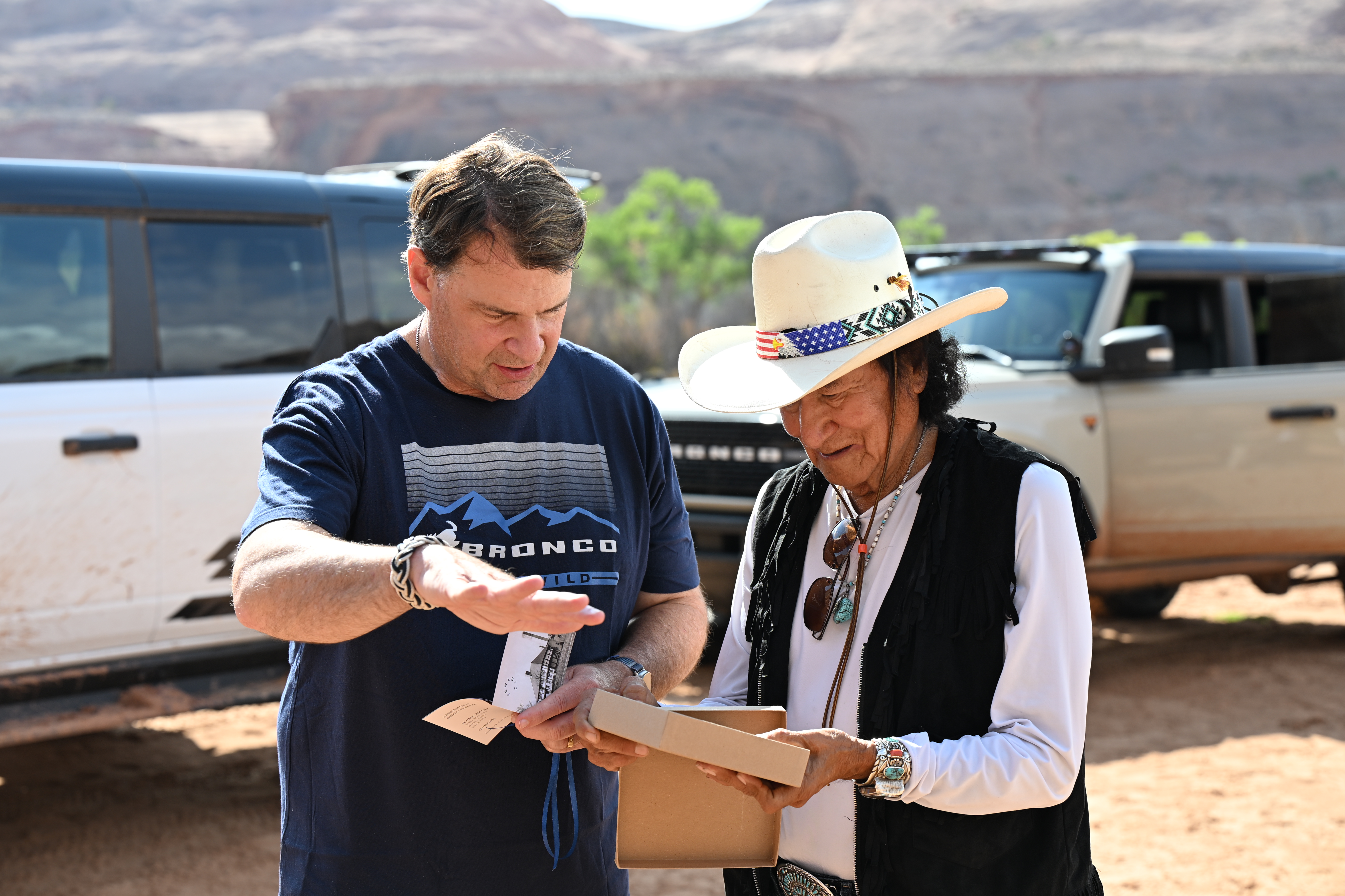 Jim Farley gifts Don Mose a Ford Motor Co. Pewabic tile