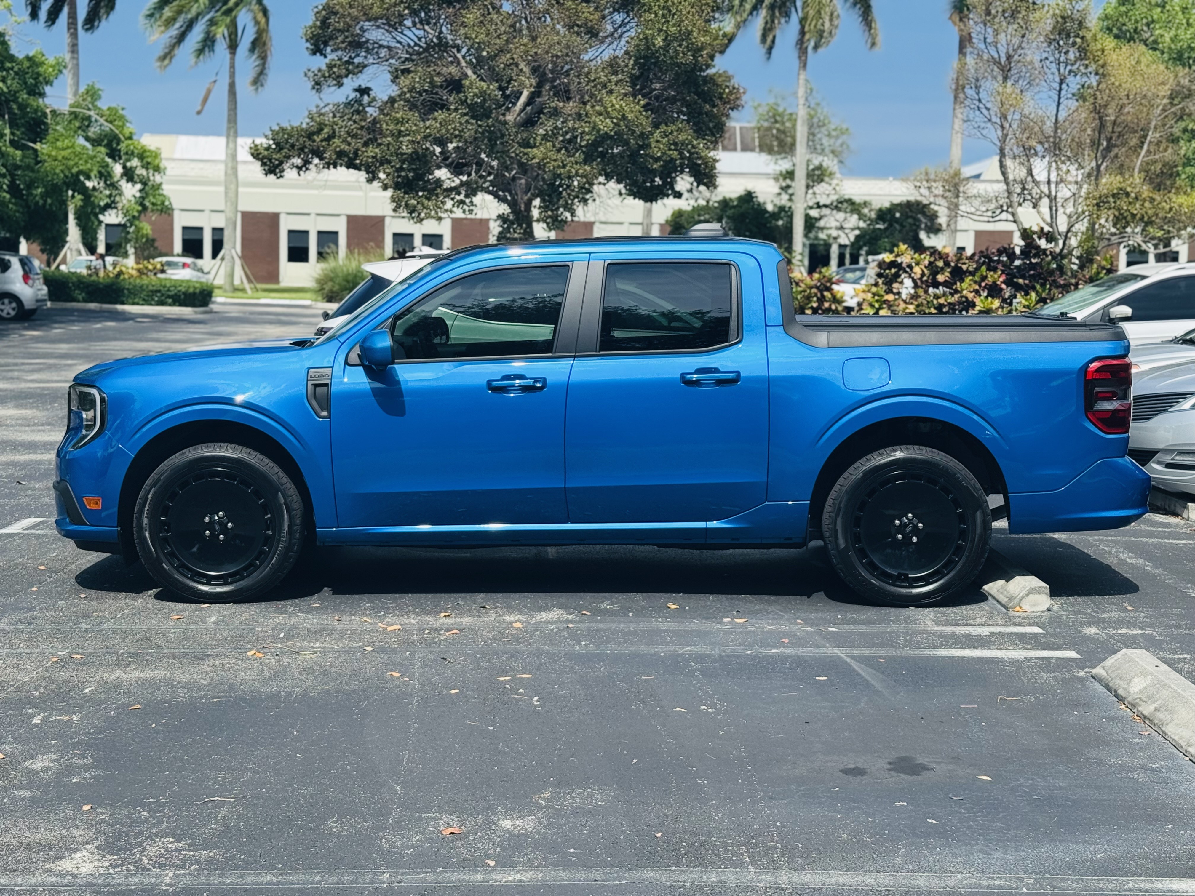 Blue Maverick Lobo parked in a parking lot