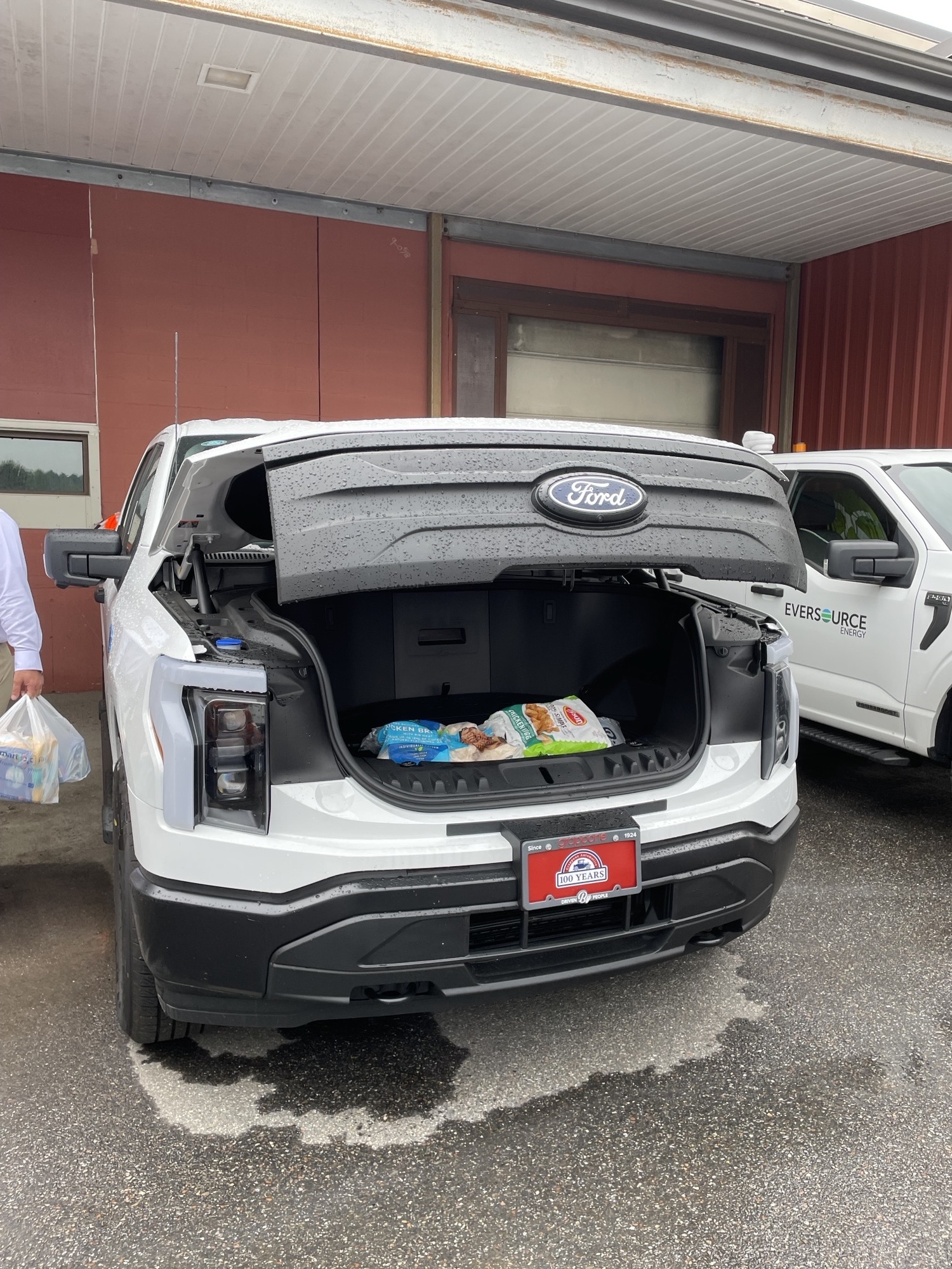 The frunk of an F-150 Lightning helped keep food cold during the food drive at Grappone Ford.