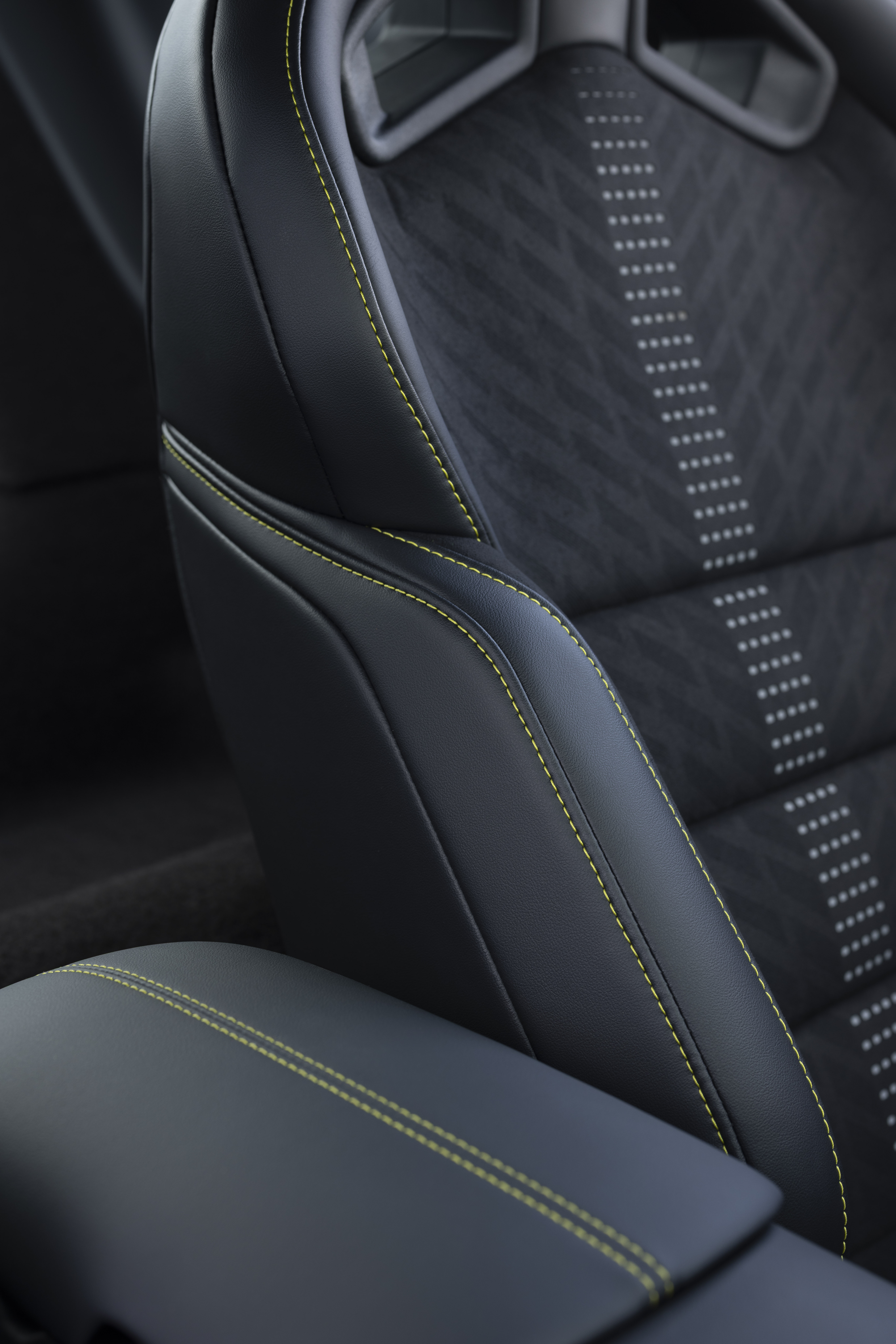 New Mustang Liquid Carbon interior shows lime green stitching on black and grey interior fabric.