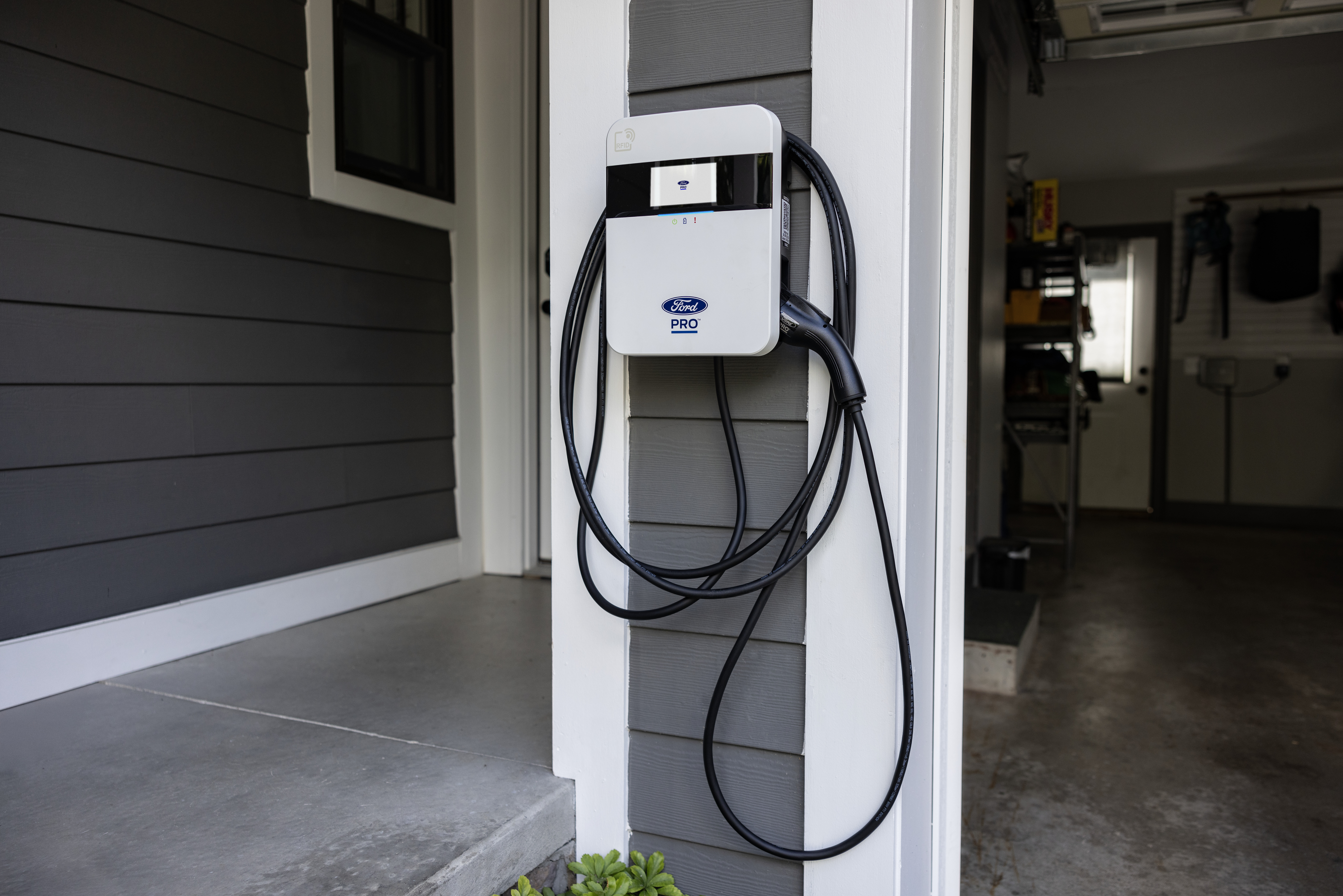 A Ford Pro electric vehicle charger isntalled at a home residence