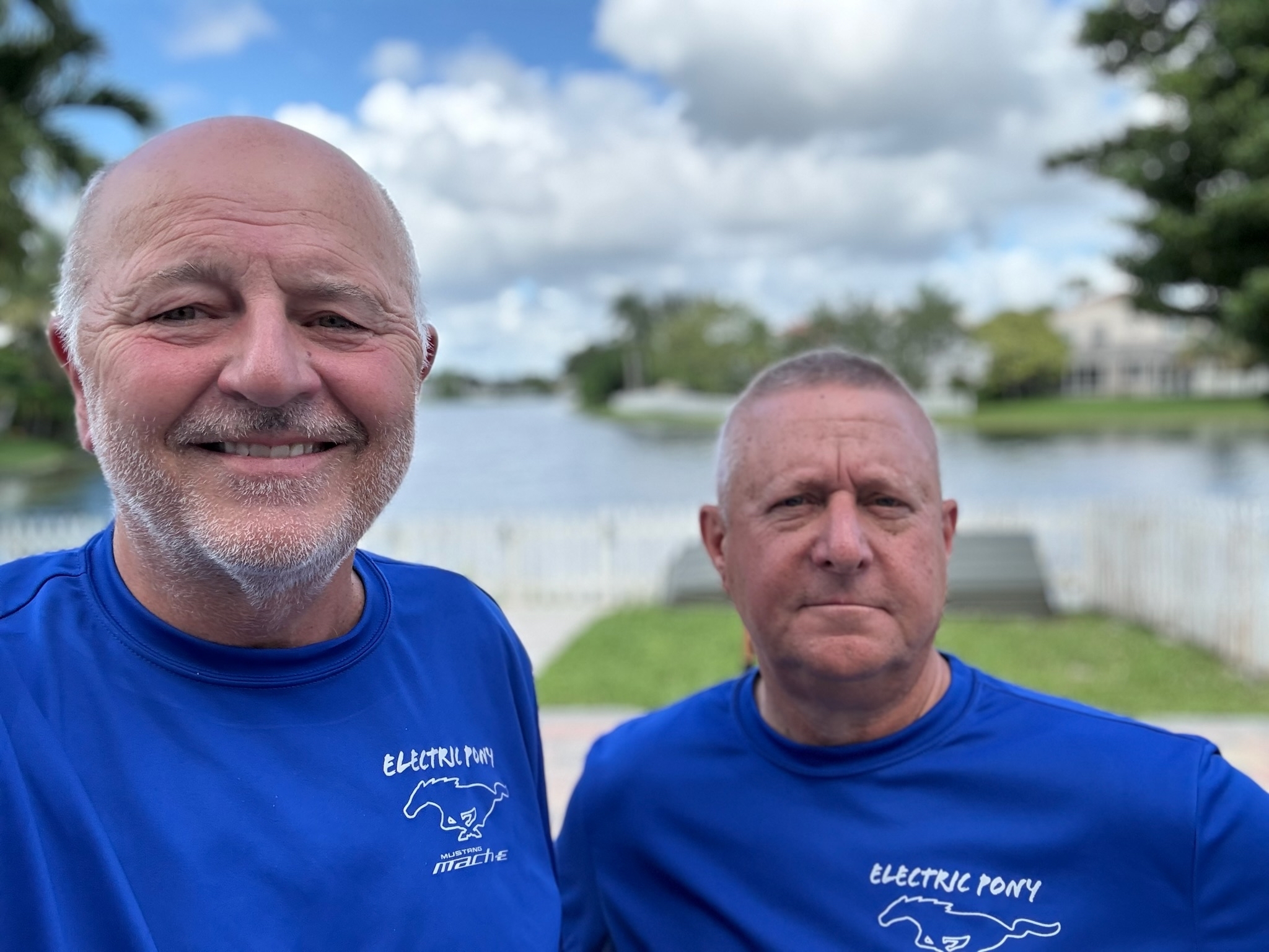 Two men pose for a selfie