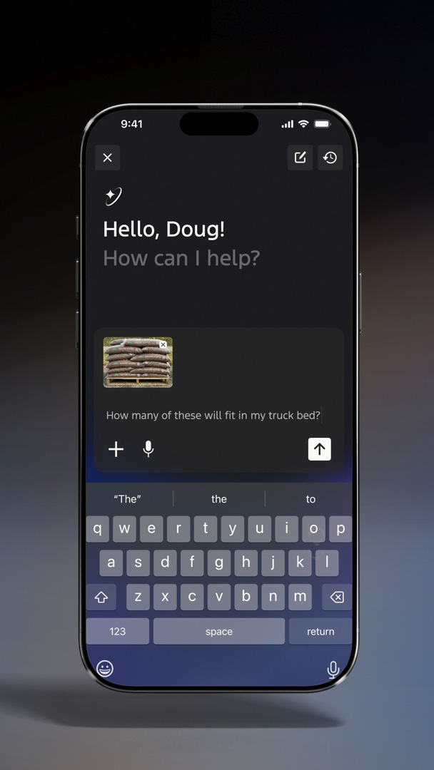A phone screen displays a conversation with an AI bot, asking how many bags of mulch will fit in the truck bed.