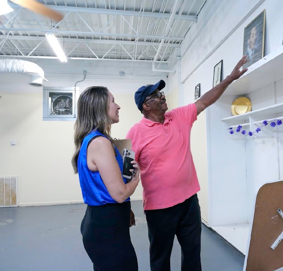 Dr. Roderick Currie with Pilgrim Rest Community Center showing Marianne Dunavant with Ford Community Relations the history of the building and what upgrades they will do with the help of the Ford Grant. 